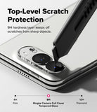 iPhone Duo | Camera Full Cover Tempered Glass (2P) - Close-up of a smartphone camera area with a transparent protective cover over the lenses and overlaid marketing text reading 'Top-Level Scratch Protection' and '9H hardness layer keeps off scratches from sharp objects.' A stylus is shown touching the camera area to demonstrate protection.