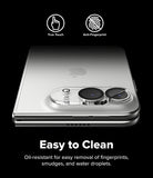 iPhone Duo | Camera Full Cover Tempered Glass (2P) - A silver smartphone case shown on a black background with feature icons for True Touch and Anti-Fingerprint, plus text reading 'Easy to Clean' and a description of oil-resistant fingerprint removal.