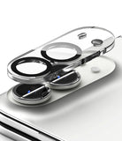 iPhone Duo | Camera Full Cover Tempered Glass (2P) - A transparent camera lens protector and lens guard set shown in an exploded view over a smartphone camera module, on a clean white background.