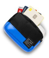Mini Pouch Tarpaulin | Brick - Blue and black tarpaulin pouch holding credit cards and white earbuds against a white background.