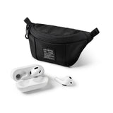 Mini Pouch | Sling Bag - Black textured mini sling bag with a branded patch next to white wireless earbuds and a charging case.