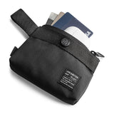Mini Pouch | 2-Way Bag Miniature - Black nylon mini pouch with a snap button, holding credit cards and a white earbud case.