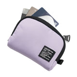 Mini Pouch | Half-Pocket - Lavender mini pouch with black trim, zipper, and a branded tag, holding three credit cards.