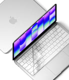 MacBook Neo | Keyskin - A clear, transparent protective keyboard and screen protector shown partially peeled off from a silver laptop, with a second closed laptop in the background on a white surface.