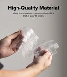 MacBook Neo | Keyskin - A person holds a flexible transparent TPU sheet to demonstrate its pliability, with text at the top reading 'High-Quality Material' and 'Made from flexible, crease-resistant TPU that is easy to clean.'.