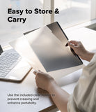 MacBook Neo Case + Protector all-groups - A person at a desk holds a clear protective cover over a tablet, with text reading 'Easy to Store & Carry' and additional usage text about using the included clear holder to prevent creasing and enhance portability.