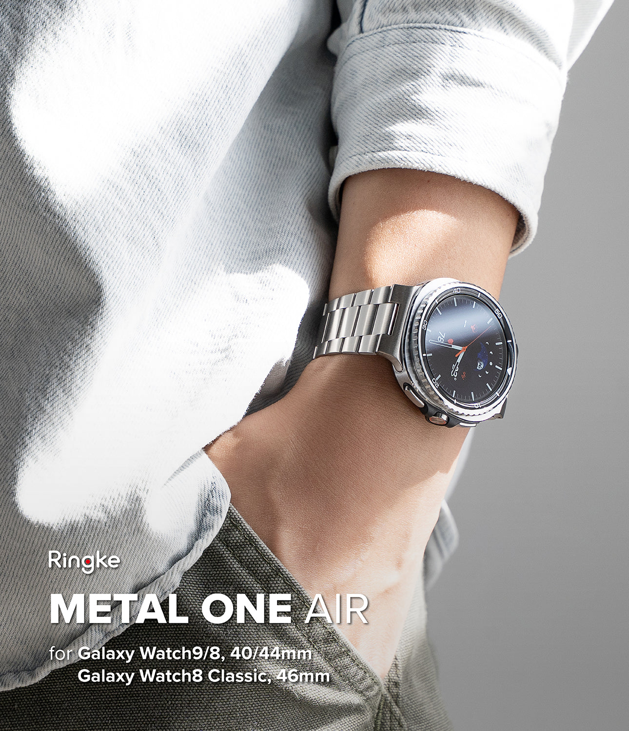 Galaxy Watch 9 / 8 | Metal One Air - A silver stainless steel smartwatch with a metal link band worn on a person's wrist, styled with a light gray shirt. Text overlay on the bottom left reads 'Ringke METAL ONE AIR for Galaxy Watch9/8, 40/44mm Galaxy Watch8 Classic, 46mm'.