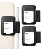 Pen Holder | Name Tag (2P) - Three black leather luggage tags with elastic straps on a white background, shown alongside a cream-colored folio and a white stylus. The tags have a white label area printed with 'Name.