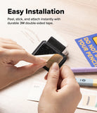 Pen Holder | Name Tag (2P) - A close-up of hands installing a black double-sided tape stamp pad onto a stamping machine, with text overlay reading 'Easy Installation' and a desk background with stationery.
