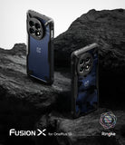[Bundle] OnePlus 13 | Fusion-X - Two OnePlus 13 phones in blue textured and camo Fusion-X cases standing on dark volcanic rock.