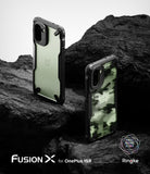Ringke Fusion-X for OnePlus 15R case - one black and one camouflage, on a rocky surface.