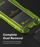 Google Pixel 10a Screen Protector | Easy Slide Tempered Glass - A close-up of a transparent lime green protective phone case with a black screen protector inside, on a dark reflective surface. White text at the bottom reads 'Complete Dust Removal' with smaller descriptive text below.