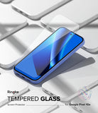 [Bundle] Google Pixel 10a Case | Onyx - Google Pixel 10a Case | Onyx - Tempered glass screen protector hovering above a blue Google Pixel 10a smartphone.