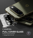 Pixel 11 Pro XL Camera Protector | Camera Full Cover Tempered Glass (2 Pack) - Ringke Camera Full Cover Glass premium protector shown applied to a gold-toned Google Pixel 11 Pro XL smartphone, with the black protector film and its packaging visible on a dark reflective surface. Text on the image reads 'Ringke CAMERA FULL COVER GLASS' and 'for Google Pixel 11 Pro XL'.