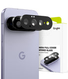 Google Pixel 11 Camera Protector | Camera Full Cover Tempered Glass (2 Pack) - Three black Ringke camera full cover tempered glass protectors shown attached to a light lavender smartphone, with the product packaging box visible behind it on a white background.