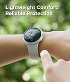 Pixel Watch 5 / 4 45mm | Case + Screen (2P) - A smartwatch with a light gray band worn on a person's wrist, with a finger touching the side of the watch. The background is a blurred green outdoor setting, and the text at the top reads 'Lightweight Comfort, Reliable Protection'.