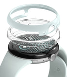 Pixel Watch 5 / 4 41mm | Slim (2P) - A smartwatch with a pale mint green band and black case, shown with a transparent protective bumper and a matching pale mint green ring accessory against a white background.