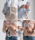 Holder Link Puffer | Hand - Four-panel collage showing colorful, quilted puffer-style wrist straps attached to phones and cases.