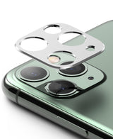 iPhone 11 Pro / Pro Max | Camera Styling - Silver metal camera lens protector hovering above a green iPhone 11 Pro camera module.