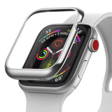 Apple Watch 3 / 2 / 1 (42mm) | Bezel Styling - A silver metal bezel cover hovering above an Apple Watch with a white band.