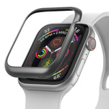 Apple Watch Series 6 / 5 / 4 / SE (40mm) | Bezel Styling - Apple Watch Bezel Styling - A dark metallic bezel cover hovering above an Apple Watch with a white band and colorful face.