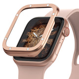 Apple Watch Series 6 / 5 / 4 / SE (44mm) | Premium Bezel Styling H - Rose gold bezel accessory hovering over an Apple Watch.