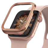 Apple Watch Series 6 / 5 / 4 / SE (44mm) | Premium Bezel Styling O - Rose gold ridged bezel hovering over a pink watch.