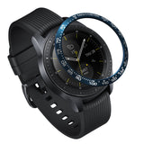 Galaxy Watch (42mm) | Bezel Styling - A blue tachymeter bezel ring hovering above a black Galaxy Watch with a ribbed strap.