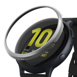 Galaxy Watch Active 2 40mm | Bezel Styling - A silver Ringke bezel accessory hovering above a black Galaxy Watch.