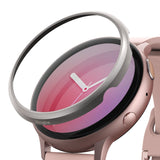 Galaxy Watch Active 2 (44mm) | Bezel Styling - A silver Ringke bezel accessory hovering above a rose gold smartwatch.