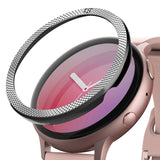 Galaxy Watch Active 2 (44mm) | Bezel Styling - A textured silver metal bezel ring hovering above a pink smartwatch.