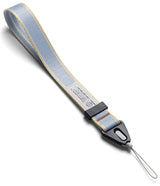 Design Hand Strap - Light blue woven wrist strap with yellow accents, black plastic connector, and a thin loop attachment.
