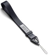 Design Hand Strap - A black fabric wrist strap with a Ringke branded plastic connector and a thin loop attachment.