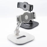 Iron Tablet Stand - Two adjustable tablet stands in white and black with folding arms and secure device grips.