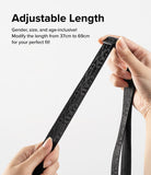 Design Lanyard Strap - Hands adjusting the length of a black patterned lanyard strap with a plastic slider.