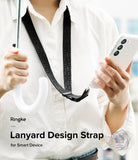Design Lanyard Strap - Person wearing a black patterned lanyard around their neck while holding a smartphone and an umbrella.