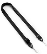 Design Shoulder Strap - A person wearing a smartphone on a black shoulder strap while holding a shopping bag at a door.