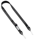 Design Shoulder Strap - Person wearing a black branded shoulder strap attached to a clear smartphone case over a yellow sweater.