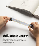 Design Shoulder Strap - A person wearing a light blue phone lanyard attached to a single hole on an orange phone case.