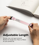 Design Shoulder Strap - Person wearing a pink and white phone strap attached to a single lanyard hole on an orange phone case.