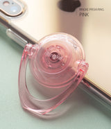 Prism Ring - A translucent pink Ringke spinner ring attached to a smartphone, featuring a faceted, gem-like design.