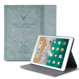 Smart Cover Design Leather Stand | iPad - Blue leather iPad case with deer and windmill graphics, propped up as a stand.