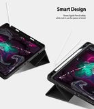 Smart Cover Apple Pencil Stand | iPad - Black tablet case with a kickstand shown in two angled views on a light gray background, with a stylus resting beside each tablet and text reading 'Smart Design' and a smaller descriptive copy.