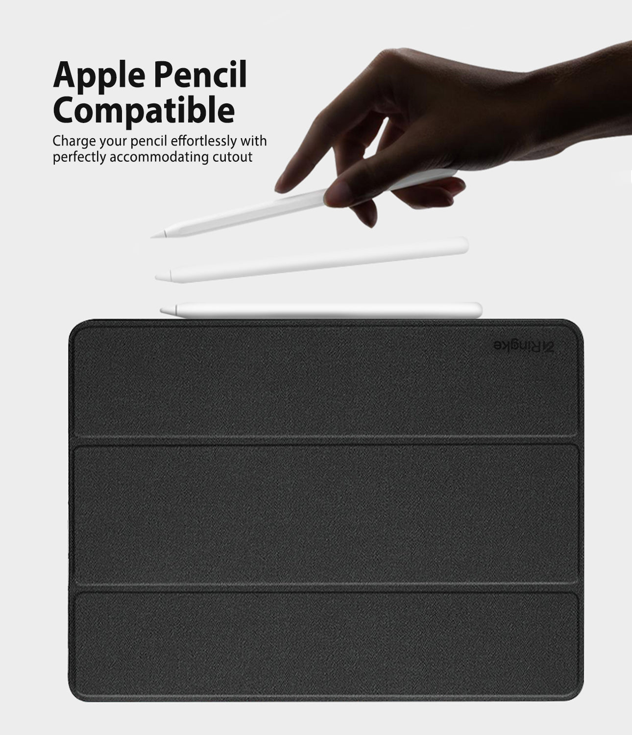 Smart Cover Apple Pencil Stand | iPad - A black textured tablet case shown on a light gray background, with three white stylus pens floating above it. A human hand is visible holding one stylus, and text at the top reads 'Apple Pencil Compatible' with a smaller explanatory line.