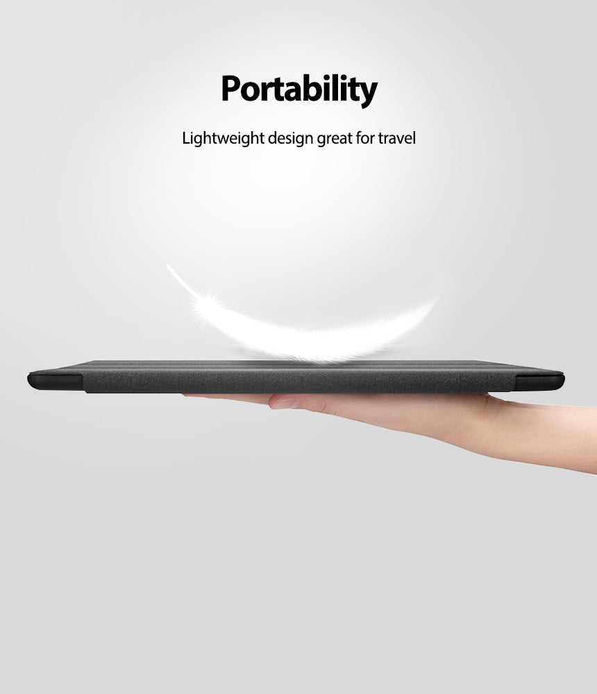 Smart Cover Apple Pencil Stand | iPad - A dark gray tablet case is shown being held horizontally by a person's hand against a light gray background, with marketing text above reading 'Portability' and 'Lightweight design great for travel.' Because a visible body part is present, this falls under Lifestyle rather than Product/Packaging, even though the focus is still the product.