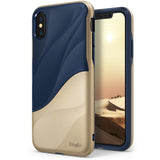 iPhone X Case | Wave - Two-tone navy blue and gold phone case with a wavy design and a desert landscape screen display.