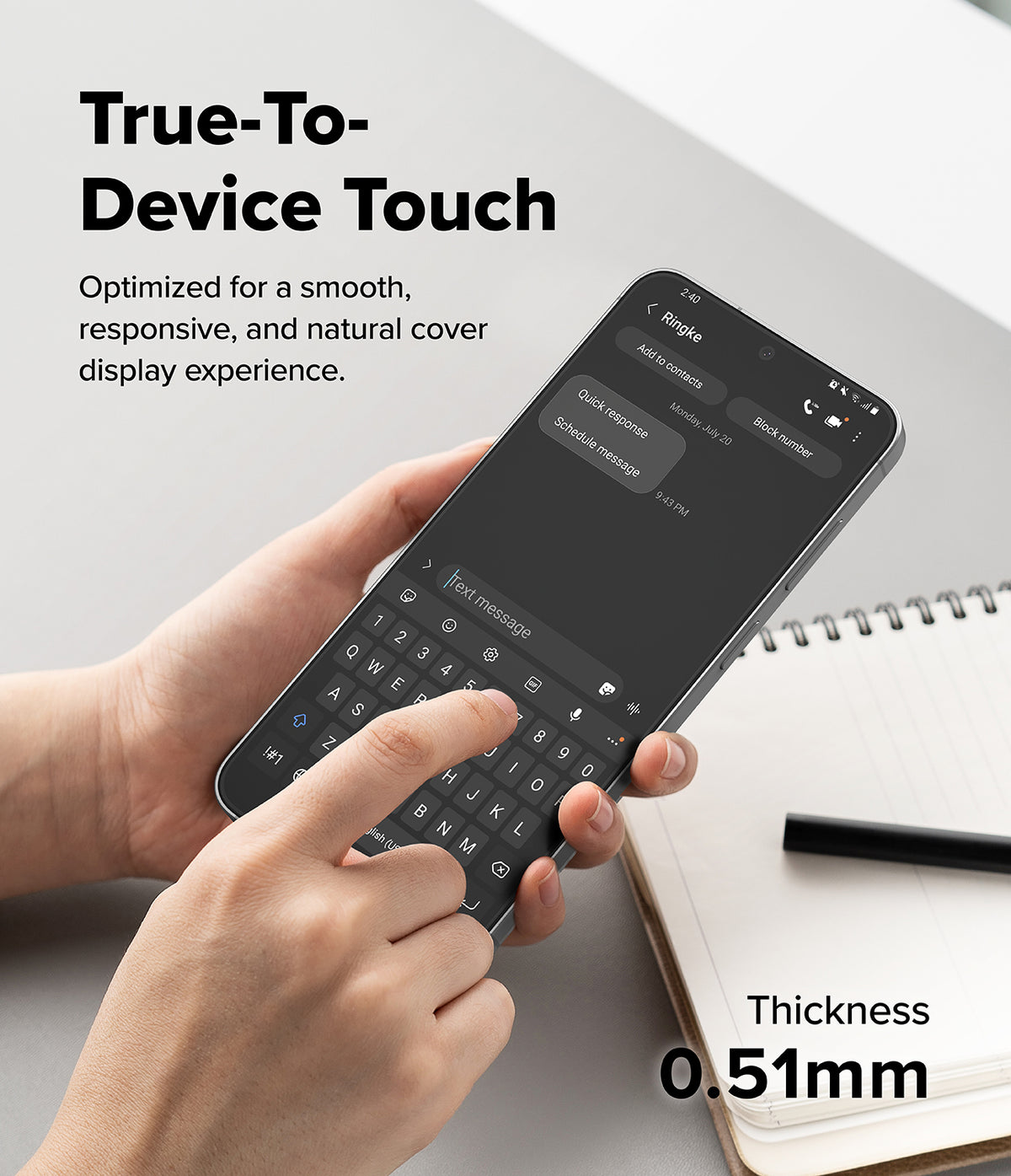 Bundle 15% Galaxy S26 FE Screen Protector | Easy Slide Tempered Glass all-groups - A hand holds a smartphone showing a keyboard cover overlay, with text reading 'True-To-Device Touch' and 'Thickness 0.51mm' on a light desk background with an open notebook and pen.
