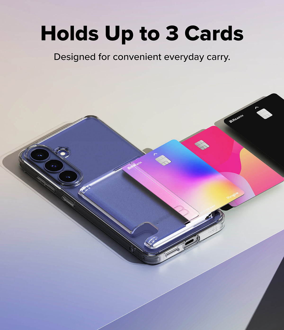 Galaxy S26 FE Case | Fusion Card - A clear phone case with a built-in card holder and three card slots, shown holding a blue phone, a pink card, and a black card. Text at the top reads 'Holds Up to 3 Cards' and 'Designed for convenient everyday carry.