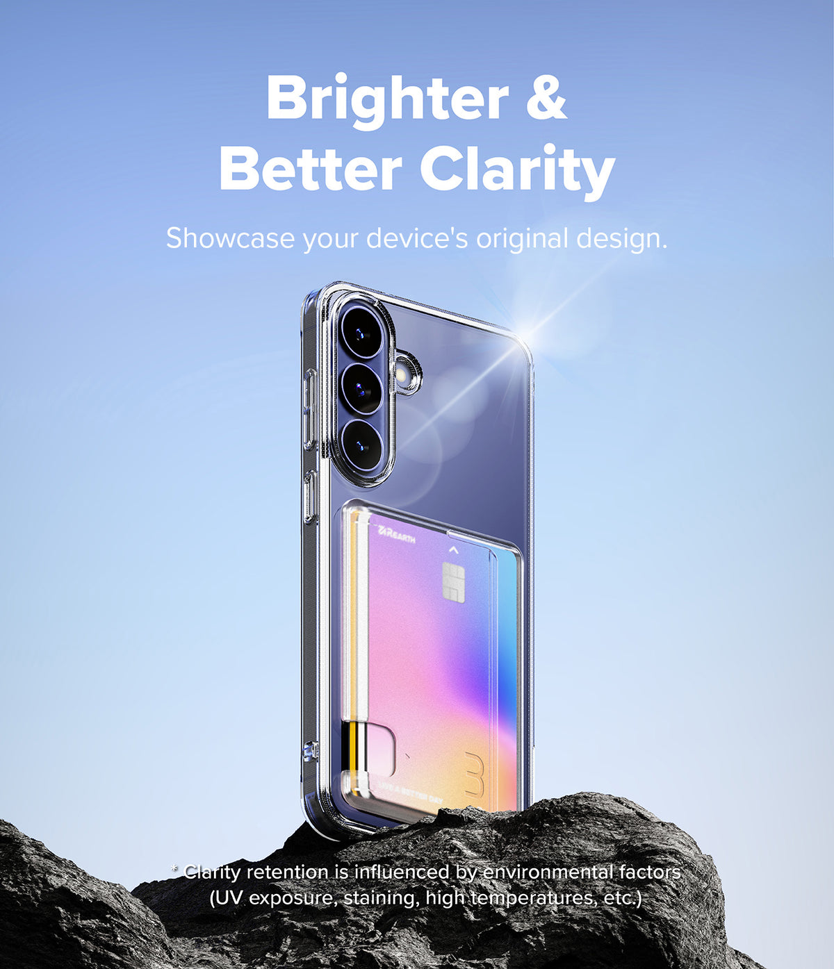 Galaxy S26 FE Case | Fusion Card - A clear protective phone case with a built-in card holder pocket, shown standing on dark rocks against a blue sky background. White text at the top reads 'Brighter & Better Clarity' and 'Showcase your device's original design.
