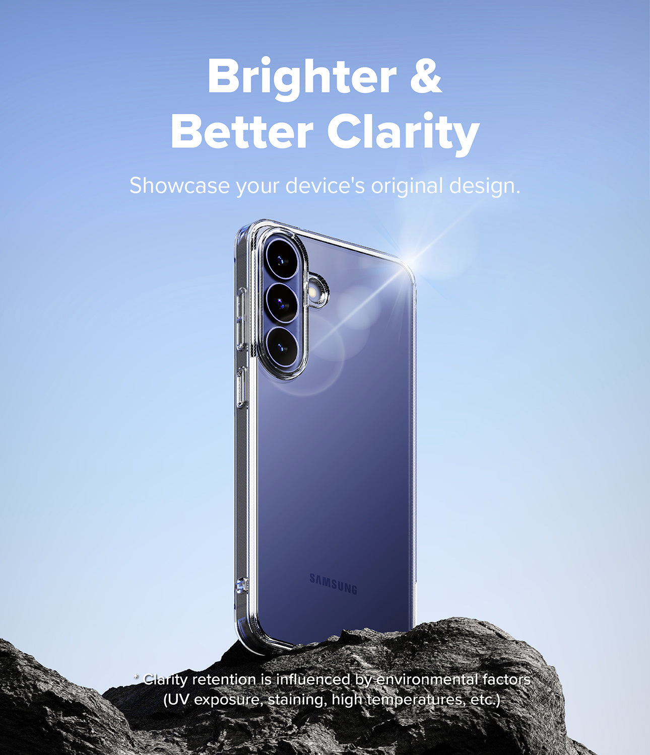 Galaxy S26 FE Case | Fusion - A clear protective phone case shown on a Samsung smartphone, standing on dark rocks against a blue sky background. White text at the top reads 'Brighter & Better Clarity' and says to showcase the device's original design.